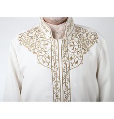 Men's Embroidered Turkish Cubbe Islamic Thobe - White This thobe is intricately designed with beautiful details and modern cuts! Features an embroidered short mandarin collar, has a hidden button down closure design, loose sleeves and inside chest pocket. This thobe will keep you looking smooth and sophisticated. Great for special occasions such as Eid, Ramadan, Weddings and more! FEATURES: Mandarin collar Hidden closure with partial button down Nylon lining with an inside chest pocket Gold Embr Thobes Men, Sports Hijab, Small Wall Decor, Eid Ramadan, Islamic Wall Decor, Hijab Pins, Childrens Rugs, Islamic Decor, Closure Design