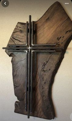 a wooden cross hanging on the wall