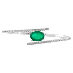 Item Code :- SEB-6308B Gross Weight :- 11.94 gm 18k Solid White Gold Weight :- 11.09 gm Natural Diamond Weight :- 0.65 carat ( AVERAGE DIAMOND CLARITY SI1-SI2 & COLOR H-I ) Emerald Weight :- 3.61 carat ✦ Sizing ..................... We can adjust most items to fit your sizing preferences. Most items can be made to any size and length. Please leave a note at checkout or contact us via 1stDibs conversation. Even after purchasing the item, you can still ask us to adjust the size or length. We will Gemstone Bangle Bracelets, Gemstone Bangle, Vintage Bangles, Emerald Stone, Emerald Gemstone, Diamond Clarity, Pave Diamonds, Indian Jewelry, Bangle Bracelet