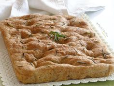 a square pastry sitting on top of a white doily