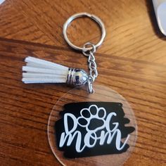 a keychain with the word dog mom on it