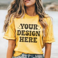 One eye-catching option for showcasing your garment designs is the Comfort Colors C1717 Mustard Tee Mockup, which features the inviting and warm shade of mustard yellow. An nice and realistic backdrop for your graphics or text, this mockup showcases the Comfort Colors C1717 in a gentle yellow tone. The mockup of the mustard yellow shirt exemplifies the quality and comfort for which Comfort Colors is renowned, capturing the garment's snug fit and relaxed feel. No matter the occasion--casual wear, Yellow Cotton Shirt With Custom Print, Yellow Cotton Tops With Custom Print, Yellow Short Sleeve Tops With Custom Print, Casual Yellow Cotton Sublimation Design, Yellow Crew Neck Top With Custom Print, Yellow Short Sleeve T-shirt With Branding, Custom Print Crew Neck Tops, T Shirt Template, Tee Mockup