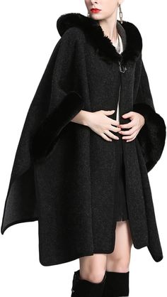 This Stylish Wool Hooded Fur Poncho Cardigan is guaranteed to keep you warm with its high-quality wool material and detachable fur hood. Its unique poncho design makes it a fashionable, timelesBurguFabric: Wool Blend Wool lining Buckle closure Machine Wash Stylish wool blend poncho coat with fur trim on the sleeve and hood Open front style with buckle, Batwing sleeve, Loose fit One Size: Bust:41.33''(105cm) Suitable for size M, L, XL. Length: 32.7''(83cm) Sleeve: 17.71''(45cm) Brand Size Dress B Elegant Fur Cape Coat With Faux Fur Trim, Fall Poncho With Faux Fur Trim Cape, Winter Faux Fur Poncho With Trim, Luxury Wool Poncho, One Size, Poncho Design, Poncho Coat, Poncho Cardigan, Luxury Long-sleeved Wool Coat With Faux Fur Trim, Winter Knit Hats