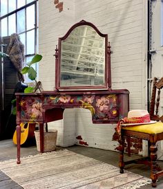 a room with a chair, mirror and rug on the floor