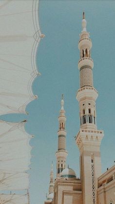 a large white building with two tall towers