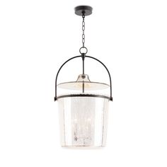 a light fixture hanging from the ceiling with a glass shade on it's side