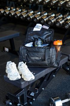 the gym equipment is neatly organized and ready to be used by someone who likes to work out