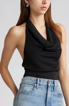 Softly draped in front and cut daringly low in back, this halter top stuns whether you're coming or going. 18" center front length (size Medium) Halter neck Ties at neck Cowl neck 100% polyester Machine wash, tumble dry Imported Black Cowl Neck Top, Black Halter Neck Top Outfit, Tie Neck Top, Low Cut Top Outfit, Black Fitted Top Outfit, Halter Neck Outfit, Draped Tops, Sleeveless Tops For Women, Halter Top Outfit Ideas