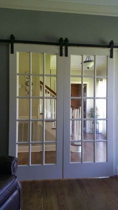 the sliding glass doors are open and ready to be used in this home's living room