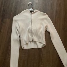 Brandy Melville Cropped Arden Hoodie In White Size, Small, Great Condition, Never Worn Fall Casual Cropped Hooded Sweater, Casual Hooded Cropped Sweater For Fall, Winter Long Sleeve Tops With Zipper, Winter Long Sleeve Tops With Zipper Closure, Trendy Hooded Cropped Sweater For Fall, Stretch Hooded Tops With Zipper Closure, Cozy Fall Tops With Zipper Closure, Cozy Tops With Zipper Closure For Fall, Casual Hooded Cropped Sweater For Winter