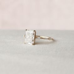 an engagement ring with a princess cut diamond