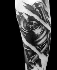 a man's arm with a black and white tattoo design