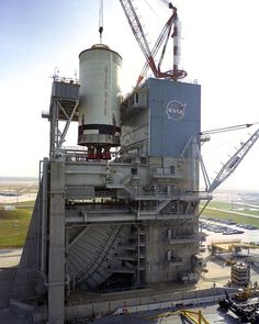 an industrial factory with cranes and machinery