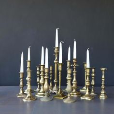 a group of brass candles sitting next to each other