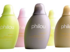 three bottles of shampoo sitting next to each other on a white surface with the words phlou written in it