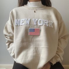 This very comfy and trendy New York sweatshirt is perfect for lounging in this cozy fall and winter season! This is also perfect for gifting to your loved ones! Please note that the letters are patches and are heat pressed, NOT embroidered. Purchasing this means you are aware and accept that. Our sweatshirts run in a UNISEX fit. The sweaters naturally have a slightly oversized fit giving extra room for moving around and comfort! For this reason, we highly recommend getting your true normal size Beige Letter Print Sweatshirt For Fall, Beige Cotton Sweater With Letter Print, Beige Letter Print Sweatshirt For Loungewear, Trendy Cream Sweatshirt With Relaxed Fit, Cream Relaxed Fit Trendy Sweatshirt, Trendy Cream Relaxed Fit Sweatshirt, Trendy Cream Cotton Sweatshirt, Cream Cotton Trendy Sweatshirt, Cream Letter Print Sweatshirt For Loungewear