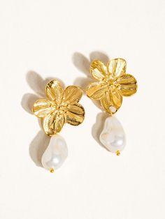 Add a touch of whimsy to your outfit with these Flower Pearl Earrings in gold. The delicate dangle design (1.75" in length) will add a playful and feminine touch to any look. Perfect for a fun and flirty style! General Info: Fashion Jewelry 18K Gold-Plated Dangle Earrings - 1.75" Earring Imported Flower Pearl Earrings, Pearl Flower Earrings, Pearl Earrings Gold, Gold Pearl Earrings, Earrings In Gold, Bow Earrings, Pearl Flower, Drop Earring, Wire Earrings