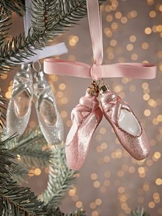 two pairs of ballet shoes hanging from a christmas tree