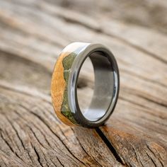 a wedding ring with wood and silver inlays