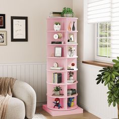 a living room with a pink book shelf in the corner