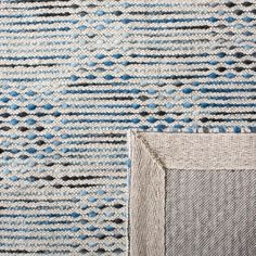 two pieces of knitted fabric with blue and gray designs on them, one is folded over the other