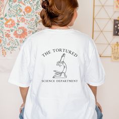 Tortured Teachers Department T-Shirt  Step into a world where comfort meets style with our Tortured Teachers Department t-shirt, tailor-made for teachers who love TS enchanting tunes. This Comfort Colors 1717 tee is your new go-to for effortless chic. Features: Unmatched Quality: Crafted from 100% ring-spun US cotton, our medium-weight fabric (6.1 oz/yd²) promises both durability and breathability. Fashion Meets Function: With a relaxed fit and classic crew neckline, this t-shirt is versatile fo English Teacher Shirt, Science Teacher Shirt, Gift Teacher, Effortless Chic, Trendy Tshirts, Look Chic, Work Casual, Teacher Shirts, Teacher Appreciation