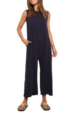 A back cutout adds to the breezy design of this linen-kissed jumpsuit fashioned with roomy legs. Pull-on style Bateau neck Sleeveless Side-seam pockets 70% rayon, 30% linen Hand wash, dry flat Imported Wide Leg Jumpsuits And Rompers With Pockets For Vacation, Casual Sleeveless Jumpsuits And Rompers With Pockets, Casual Sleeveless Jumpsuits With Slip Pockets, Beach Wide-leg Jumpsuits And Rompers With Pockets, Beach Wide Leg Jumpsuits And Rompers With Pockets, Beach Wide Leg Jumpsuits With Pockets, Sleeveless Summer Jumpsuits And Rompers With Relaxed Fit, Relaxed Fit Sleeveless Jumpsuits For Loungewear, Linen Jumpsuits And Rompers For Loungewear