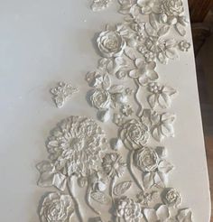 some white flowers and butterflies on a table