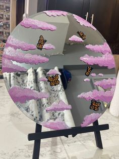 a mirror that has some butterflies on it