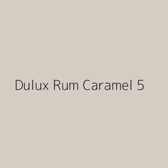 the words dulux rum caramel 5 are in black and white on a gray background