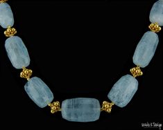 "21\" necklace of large faceted, high quality Aquamarine and 20K solid gold beads. The Aquamarine beads measure 31x19mm at center and graduate to 15x13mm at the gold toggle clasp. The total weight of the 22K gold is 15.8 grams. This is a gorgeous necklace of large, light blue iridescent Aquamarine beads that are separated in part by lovely 20K gold beads. It is a very special necklace for that special person. It is possible that you prefer a shorter length, and I can make the necklace to whateve Blue Large Beads Dangle Necklace, Blue Large Beads Necklace, Luxury Large Beaded Blue Necklace, Light Blue Aquamarine Gemstone Beads Necklace, Blue Multi-strand Necklace With Large Beads, Large Bead Necklace, K Design, Keshi Pearl Necklace, Special Necklace