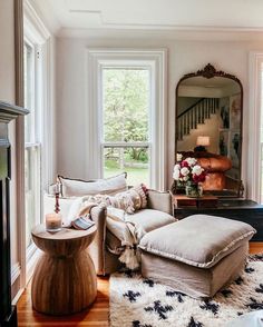 a living room filled with furniture and windows