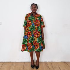 The Mosaic dress. Our loose fit colourful dresses made out of non-stretchy African print are perfect for you in case you are looking for a style idea that is versatile, comfortable, and looks fabulous year-round. All materials used to design the dresses are sourced in Kenya.  MEASUREMENT GUIDE:  We recommend asking questions about sizes or you can take your own measurements (at the bust) if unsafe. Since its an A- Line, you only need to ensure that you have the right fit for the bust. Please see Casual Multicolor Printed Shirt Dress, Casual Multicolor Knee-length Shirt Dress, Oversized Multicolor Printed Dresses, Casual Multicolor Short Sleeve Shirt Dress, Multicolor Midi Length Shirt Dress, Casual Short Sleeve Multicolor Midi Dress, Casual Short Sleeve Midi Dress With Vibrant Print, Mosaic Dress, Dress Shirt Dress