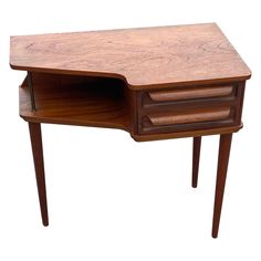 a wooden desk with two drawers on one side and an open drawer on the other