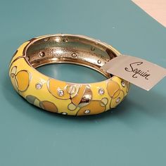 Sequin Nwt Yellow Gold Jeweled Swirl Circle Enamel Clamper Hinge Bangle Bracelet Item Seq-B-Yell-G Brand New This One Is Stunning! Maker's Signature Mark Stamped Inside Sequin, Sold At Nordstrom's Retail Value $42 Yellow Gold Round Enamel Bracelets, Retro Yellow Bangle Bracelets, Vintage Round Enamel Bangle, Luxury Enamel Bangle, Guadalupe Bracelet, Vintage Multicolor Enamel Bangle, Sequin Jewelry, Red Handbag, Rhinestone Bracelet