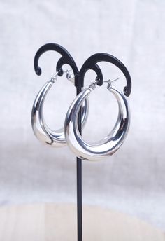 Chunky hoop earrings. Dimensions: 40 mm. Thickness from 4 mm to 8.5 mm. The hoops are made of hypoallergenic stainless steel, water resistant and weather resistant. To maintain their shine, it is advisable not to expose them to aggressive products such as shampoos, soaps, perfumes. Delivered with an organza gift bag. Sending by followed letter. Trendy Hoop Jewelry In Stainless Steel, Trendy Stainless Steel Hoop Jewelry, Modern Stainless Steel Hoop Jewelry, Nickel-free Small Hoop Stainless Steel Earrings, Nickel-free Stainless Steel Small Hoop Earrings, Nickel-free Small Stainless Steel Hoop Earrings, Minimalist Metal Hoop Earrings With Shiny Finish, Modern Small Hoop Metal Earrings, Small Stainless Steel Nickel-free Hoop Earrings