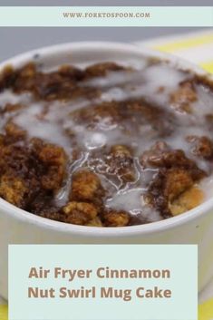 a close up of a bowl of food with the words air fryer cinnamon nut swirl mug cake