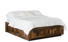 a wooden bed with white sheets and pillows