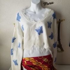 Beautiful Long Sleeve White Sweater. Cute Fringe As Decor. Cute Blue Bow Throughout The Sweater. * Large * Excellent Condition * Arm Pit To Pit: 25" * V Neck 8" * Length:17" * Sleeve: 17.5" Material: 100% Acrylic Blue Butterflies Add A Bright And Cheerful Look. Great Gift Too! Sku #0072 Butterfly Sweater, Cute Fringe, White Long Sleeve Sweater, Pink Cardigan Sweater, Free People Cardigan, Large Cardigan, Blue Butterflies, Belted Cardigan, Sweater Cute