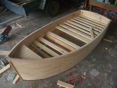 a wooden boat being built in a workshop