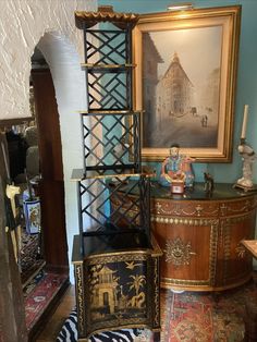 there are many different pieces of furniture in this room, including an antique cabinet and sideboard