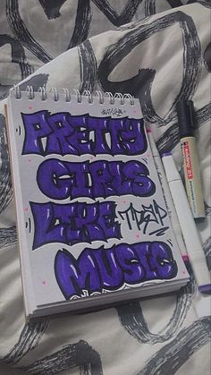 an open notebook with purple graffiti on it