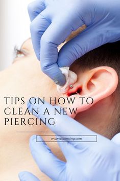 a man getting his ear examined by a doctor with blue gloves on and the words tips on how to clean a new piercing