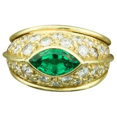 Very Fine Marquise Emerald and Diamond Ring in 18k One Very Fine Marquise Cut Emerald Weighing 1.92 Carats [Vibrant Green with No Visible Imperfections] Thirty Round Brilliant Cut Diamonds Weighing 1.94 Carats Approximately [GH VVS-VS] A One of a Kind for a One of a kind Dome Rings, Emerald And Diamond Ring, Marquise Ring, Emerald Diamond Ring, Domed Ring, Vibrant Green, Marquise Cut, Emerald Diamond, Round Brilliant Cut Diamond