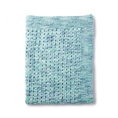 a blue knitted dishcloth on a white background