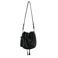 Our black leather bucket bag is a timeless classic with a modern twist. It comes with not one, but two detachable straps, so you can wear it your way. Choose between the long, luxurious black strap for a chic shoulder bag or opt for a short one, handwoven vibrant pink strap.  Additional Details  Material: Leather Color: Black Size: Medium Closure: Drawstring Hardware: Gold  Straps: Detachable Here are a few tips for storing your bag in the dust bag (include in your purchase): -Empty the bag of a Chic Everyday Luxury Crossbody Bucket Bag, Black Bucket Bag With Leather Handles, Black Leather Bucket Bag With Leather Handles, Chic Bucket Bag With Leather Lining, Black Leather-handled Bucket Bag, Chic Leather-lined Pouch Bucket Bag, Evening Crossbody Bucket Bag With Leather Lining, Leather Bucket Bag For Everyday Luxury, Soft Leather Evening Bucket Bag