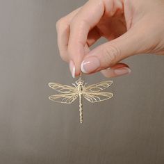 Dragonfly Earrings - Vermeil, Solid Silver, 14K Gold Plate, 14K Gold Options Description: Elevate your style with our exquisite Dragonfly Earrings, available in Vermeil, Solid Silver, 14K Gold Plate, and 14K Gold options. Crafted with precision using 3D printing technology, these earrings exude timeless elegance and nature-inspired charm. Story: These dragonfly earrings are a testament to our commitment to sustainable practices. Inspired by the delicate beauty of nature, they are crafted with ca Dragon Fly Jewelry Gold, Elegant Dragonfly Jewelry With Ear Wire, Elegant Gold Dragonfly Jewelry, Elegant Dragonfly Earrings With Ear Wire, Elegant Hypoallergenic Dragonfly Earrings, Gold Dragonfly Earrings For Gift, 3d Printed Jewelry, Surgical Steel Earrings, Dragonfly Earrings