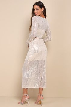 If you want to guarantee the maximum amount of compliments, then you'll definitely want to show up wearing the Lulus Greatest Sparkle Beige Mesh Sequin Fringe Two-Piece Midi Dress! Shiny silver sequins create a fringe-like effect across sheer beige mesh as it shapes this stunner of a dress, that starts with a fitted crop top with a crew neckline and long sleeves. The matching skirt features a flattering high-rise fit and a figure-skimming silhouette that finishes at a modern midi hem. Hidden sid