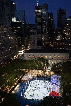 an aerial view of the ice rink at night in new york city's financial district