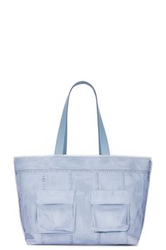 Find ACNE STUDIOS Midsummer Shopper Bag In Blue on Editorialist. Acne Studios Midsummer Shopper Bag in Blue Canvas exterior and interior. Made in Italy. Open top with frayed trim. One main compartment. Interior zipper pocket. Front slip pocket. Printed novelty pockets throughout and dual leather shoulder straps. Measures approx 14.5 W x 12 H x 7 D Shoulder strap with a 10.5 drop. ACNE-WY93. A10364. About the designer: Acne Studios is a Stockholm-based fashion house with a multidisciplinary approach. Through founder and Creative Director Jonny Johansson’s interest in photography, art, architecture and contemporary culture, an alternative path has been found, turning Acne Studios into a well-respected creator of ready-to-wear, magazines, furniture, books and exhibitions. The collections are Chic Cotton Bags With Pockets, Canvas Bags With Zipper Pocket For Shopping, Canvas Tote Bag With Zipper Pocket For Shopping, Chic Canvas Tote Bag With Pockets, Canvas Bag With Zipper Pocket For Summer, Shopping Canvas Tote Bag With Zipper Pocket, Chic Canvas Shoulder Bag With Pockets, Summer Canvas Shoulder Bag With Zipper Pocket, Summer Canvas Shoulder Bag With Pockets